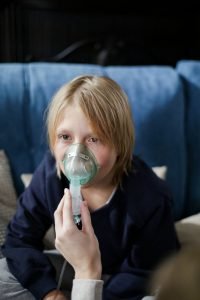 Child protected from air pollution during Lahore winter smog