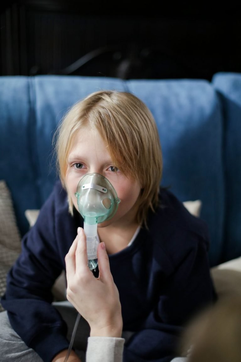 Child protected from air pollution during Lahore winter smog